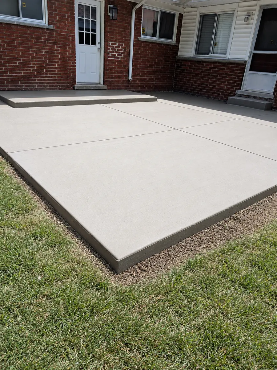 Broom-finish concrete backyard patio in Redford, MI